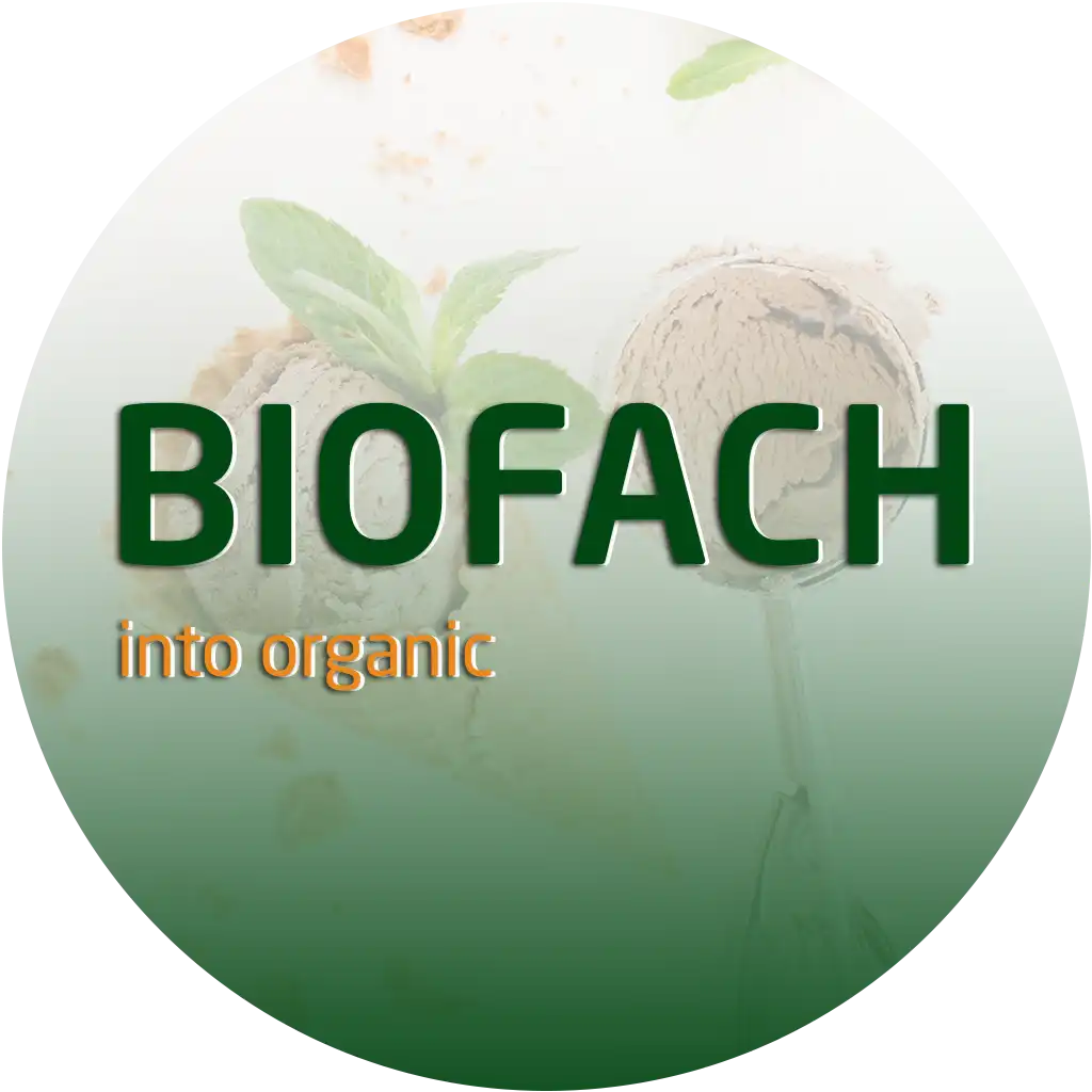 BIOFACH logo with green letters and tagline ‘into organic’ against a circular background with faded leaves.